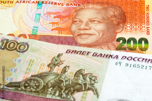 Wallpaper Mural 200 South Africa rand and 100 Russian ruble banknotes. International trade concept Torontodigital.ca
