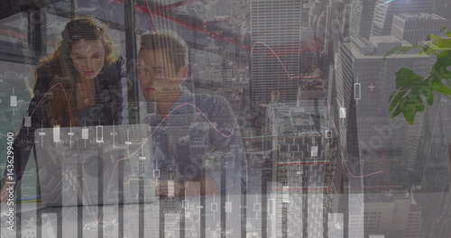 Image of financial data processing over diverse business people using laptop