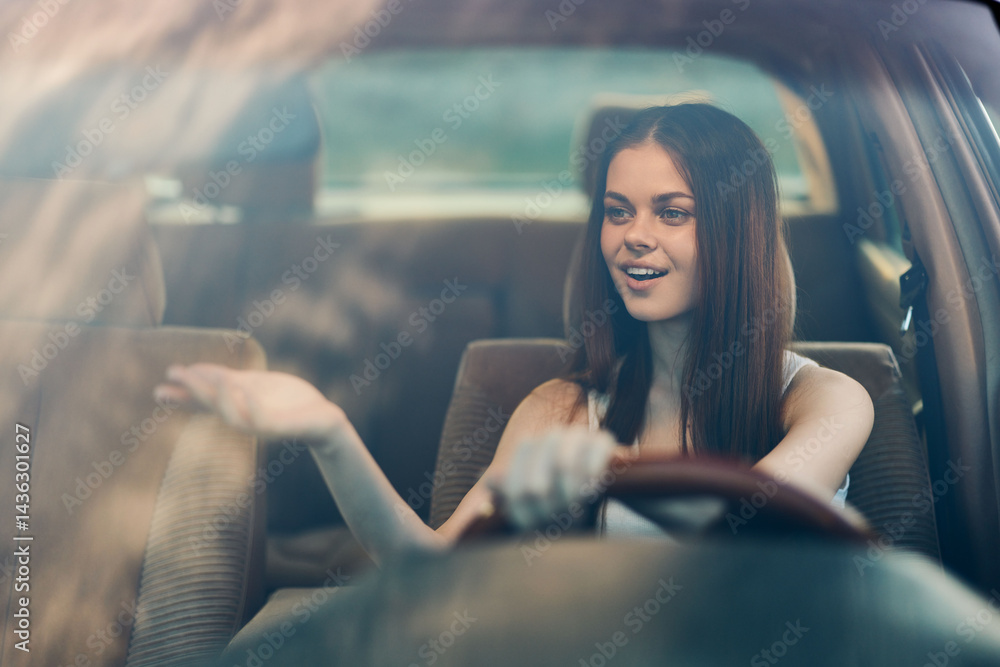 Fototapeta premium Happy young woman driving a car, enjoying the ride with a cheerful expression and stylish attire, green background, capturing the concept of freedom and adventure.