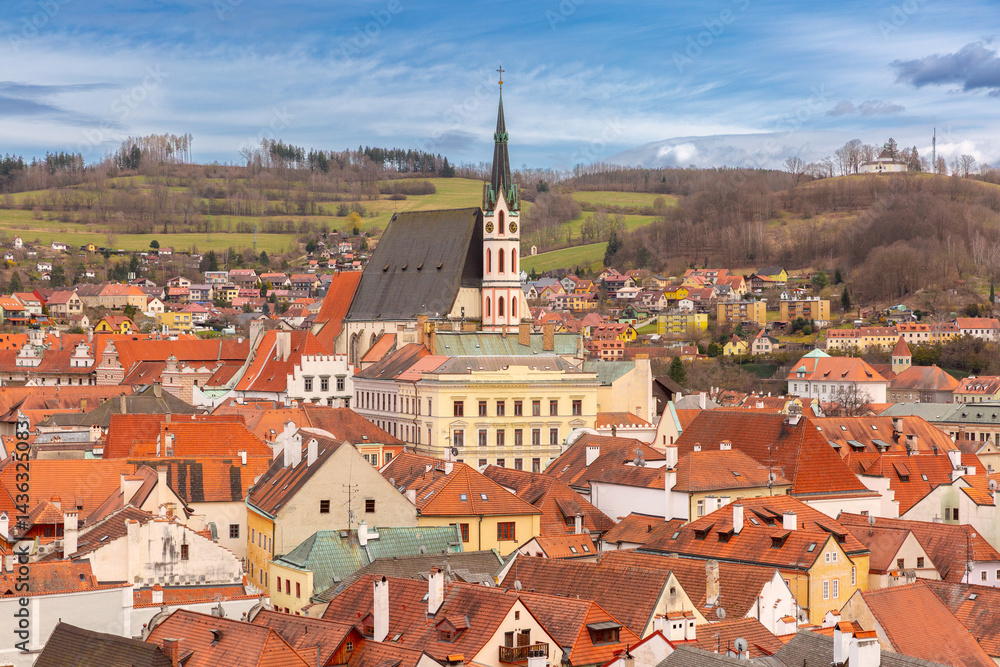 Aerial view of rooftops and church tower in Cesky Krumlov, Czech Republic