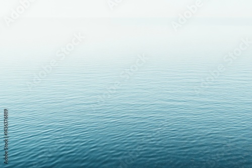 Calm water surface, soft blue hues