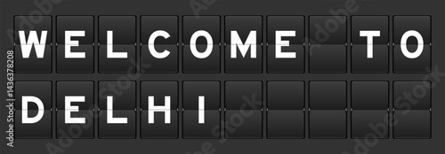 Black color analog flip board with word welcome to delhi on gray background