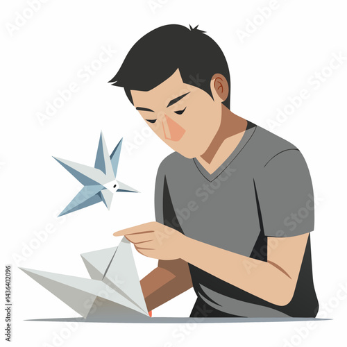 Young Man Focused on Origami Paper Folding Art