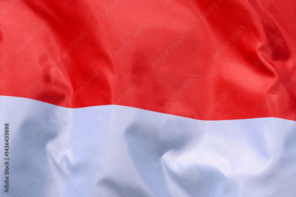 Fototapeta premium Close-up of the national flag of Indonesia fluttering in the wind, wave pattern