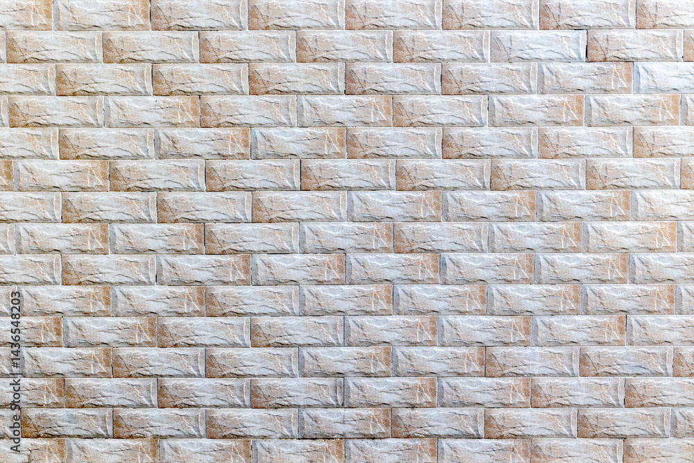 Beige rectangular brick wall texture with subtle lighting and shadow effects Beige rectangular brick wall texture with subtle lighting and shadow effects