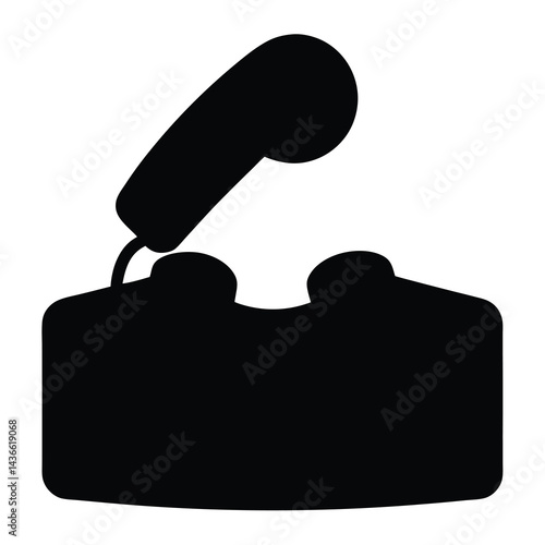 Silhouette of an old rotary telephone with the receiver off the hook