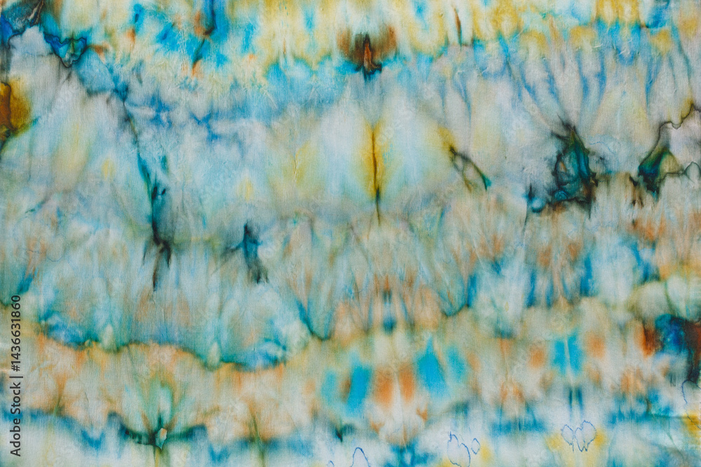 abstract pattern on silk fabric texture in blue, yellow, green colors