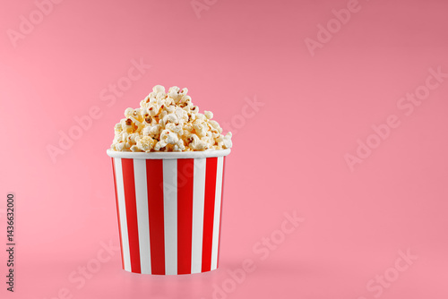 Classic red striped popcorn cardboard cup on Red background