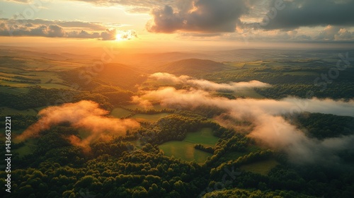 Drone view, panoramic view of forest and fields, aerial view, orange sky and gray clouds, sunset sun. Ariel view of the forests, fields, lake sky, sun, clouds, rivers, bays.