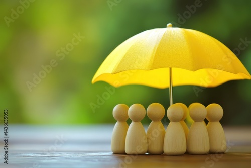 Wallpaper Mural Wooden figures under yellow umbrella on table Torontodigital.ca