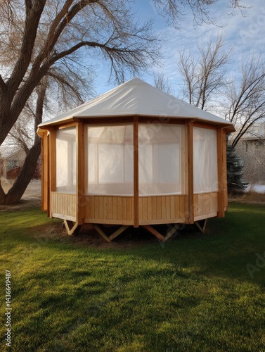 Wallpaper Mural Wooden gazebo with a white roof on a grassy lawn. the structure is rectangular in shape and has a wooden frame with a sloping roof. Torontodigital.ca