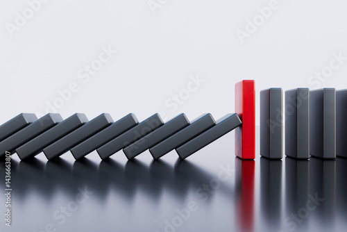 A strong domino stone that stops falling. Solution and strategy concept.