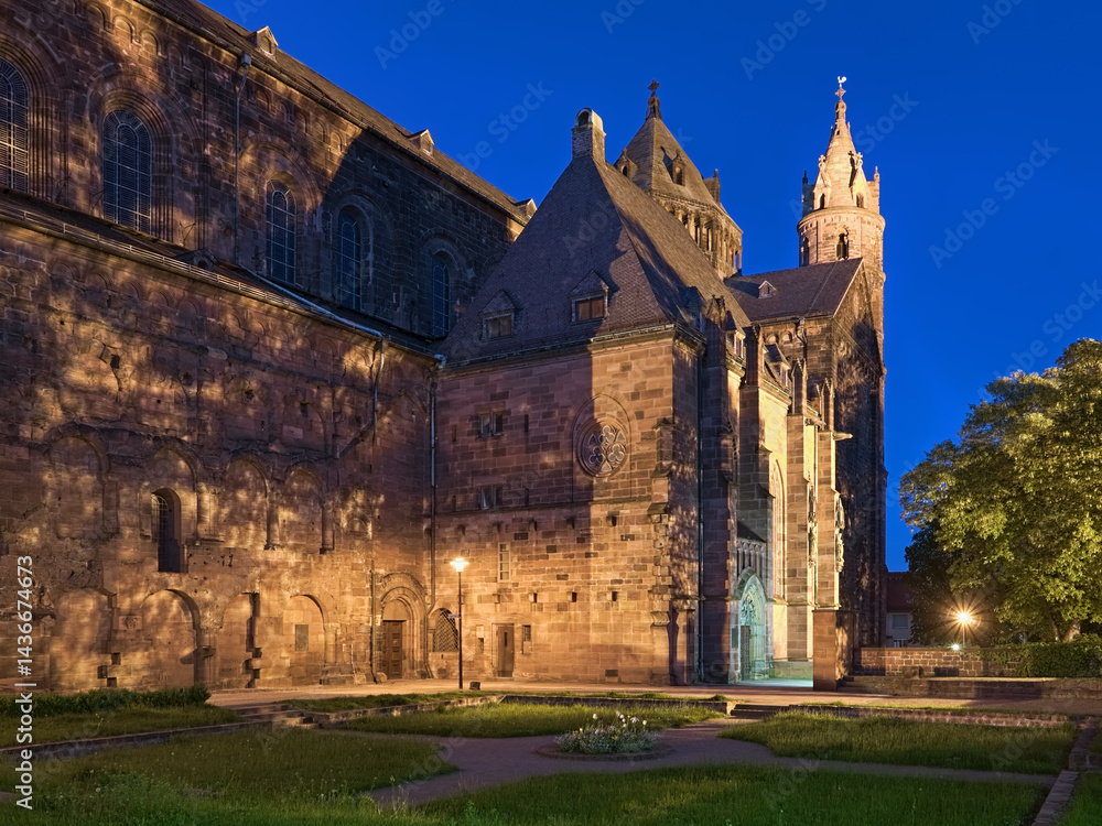 Worms, Germany. Fragment of St. Peter's Cathedral (Worms Cathedral) in dusk. View from south-west on chapel of St. Nicholas and relicts of the cloister. The cathedral was built from about 1130 to 1181