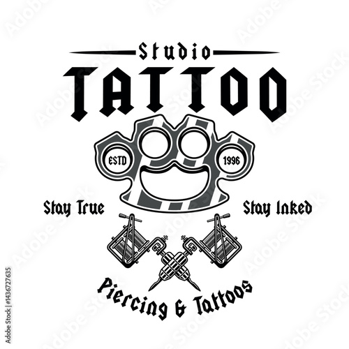 Vintage tattoo studio emblem with brass knuckles and tattoo machines. Classic monochrome vector illustration in retro style, perfect for badges, t-shirt prints and tattoo related designs