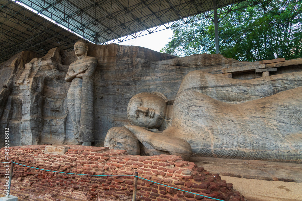 Naklejka premium Gal Vihara, four magnificent Buddha statues carved from a single granite slab in ancient Polonnaruwa, Sri Lanka