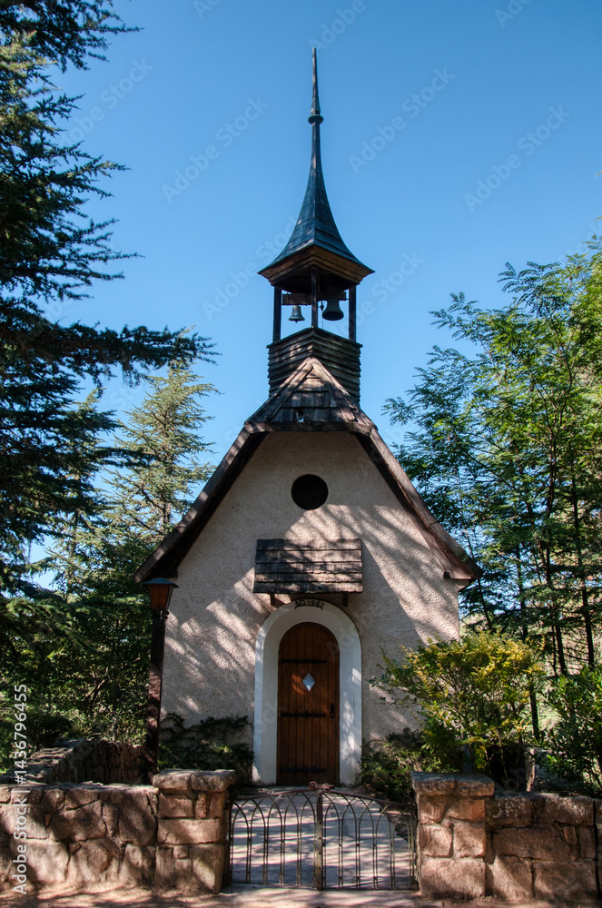 Naklejka premium Small church in the forest at the mountain town of La Cumbrecita, Cordoba, Argentina