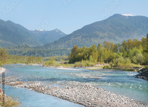 Title: Chilliwack River as seen from the Vedder Rotary Trail North during a spring season in Chilliwack, Fraser Valley, British Columbia, Canada