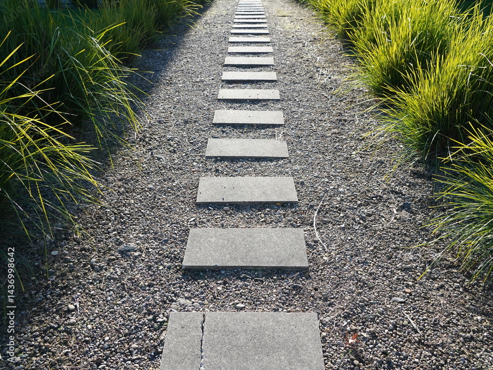 Obraz premium A straight pathway made of square paving stones