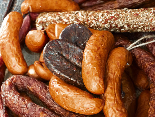 Wallpaper Mural Savory assortment of artisanal sausages crafted with traditional methods at a local market Torontodigital.ca