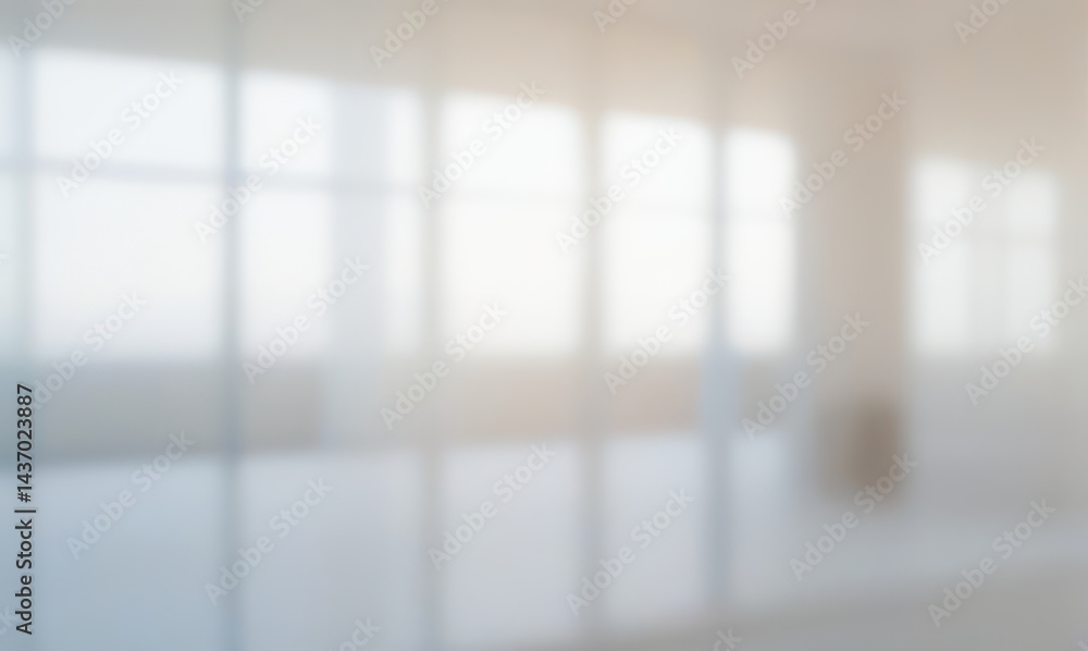 Blurred office interior with large windows and bright light. Blurred office interior with large windows and bright light.