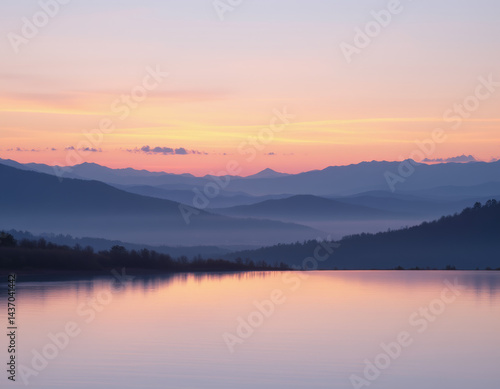 Tranquil landscape featuring serene lake reflecting soft pastel colors of sunset, surrounded by misty mountains and peaceful atmosphere