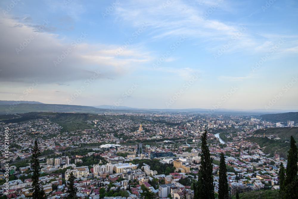Fototapeta premium Cityscape of Tbilisi, the capital of Georgia, aerial panoramic view from Mtatsminda Park