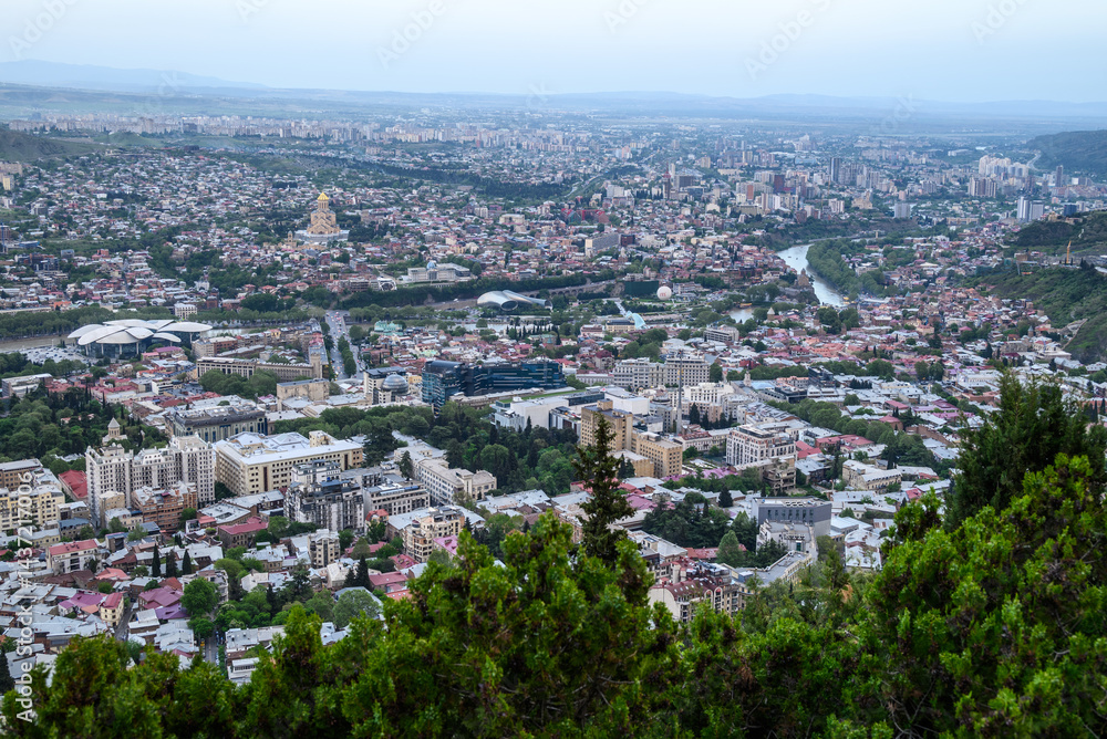 Fototapeta premium Cityscape of Tbilisi, the capital of Georgia, aerial panoramic view from Mtatsminda Park