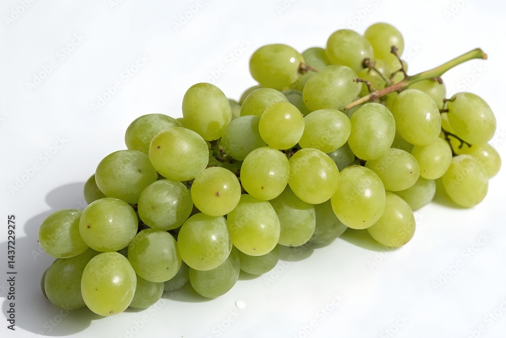 A bunch of green grapes placed neatly, isolated with soft shadow on white. A bunch of green grapes placed neatly, isolated with soft shadow on white.