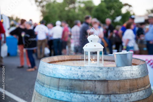 Candle on a barrel at outdoor party