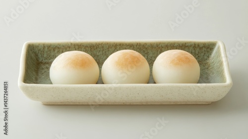 Trio of Mochi on Flat Tray with Neutral Background