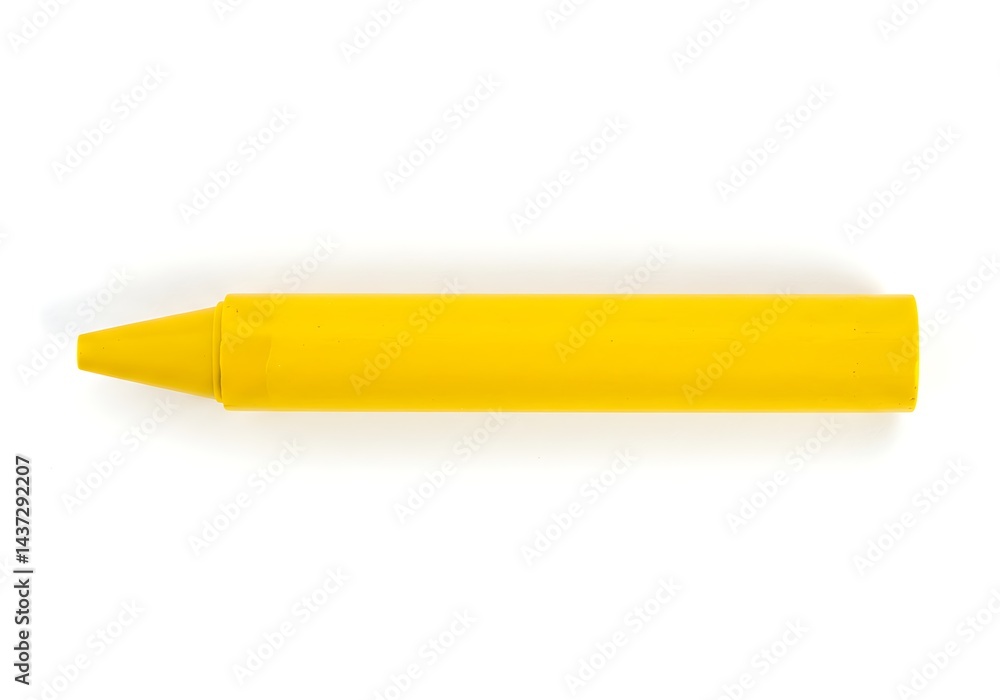 A single yellow crayon lying horizontally on a white surface in a studio shot with good lighting A single yellow crayon lying horizontally on a white surface in a studio shot with good lighting