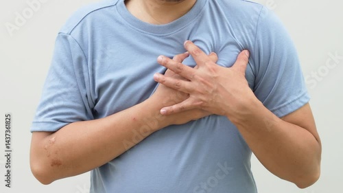 Man with chest pain is symptom of heart disease.