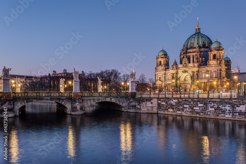 The Berlin Cathedral and a bridge over a canal at night