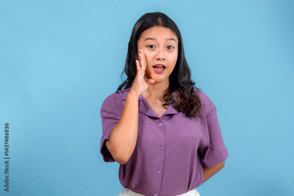 Young Asian woman with expressive face shouting or calling out, showing surprise and enthusiasm. Studio portrait with casual style, perfect for advertising and communication concepts. Young Asian woman with expressive face shouting or calling out, showing surprise and enthusiasm. Studio portrait with casual style, perfect for advertising and communication concepts.