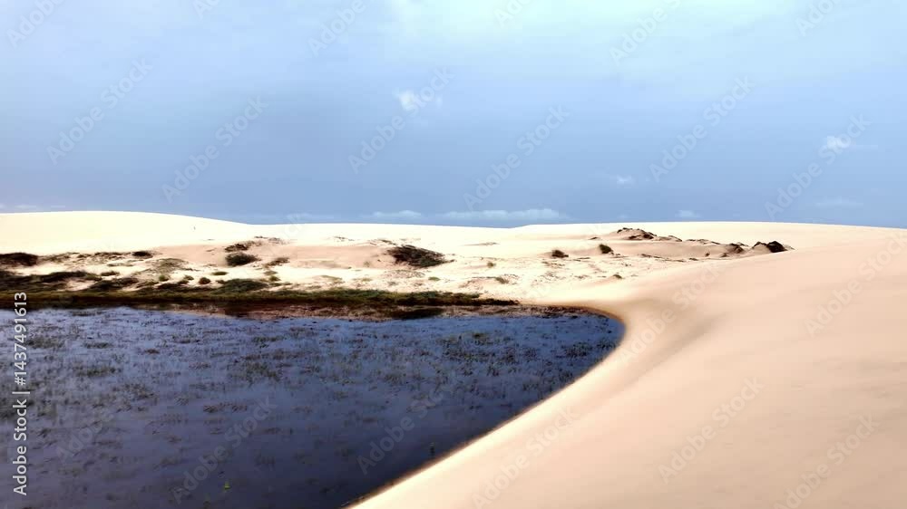 Dunes and lagoons of Atins, Lencois Maranhenses, Barreirinhas in Brazil. White sand dunes with pools of fresh and transparent water. Dunes and lagoons of Atins, Lencois Maranhenses, Barreirinhas in Brazil. White sand dunes with pools of fresh and transparent water.
