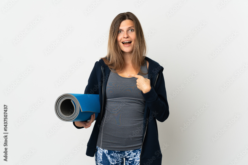 Slovak girl going to yoga classes isolated on white background with surprise facial expression Slovak girl going to yoga classes isolated on white background with surprise facial expression