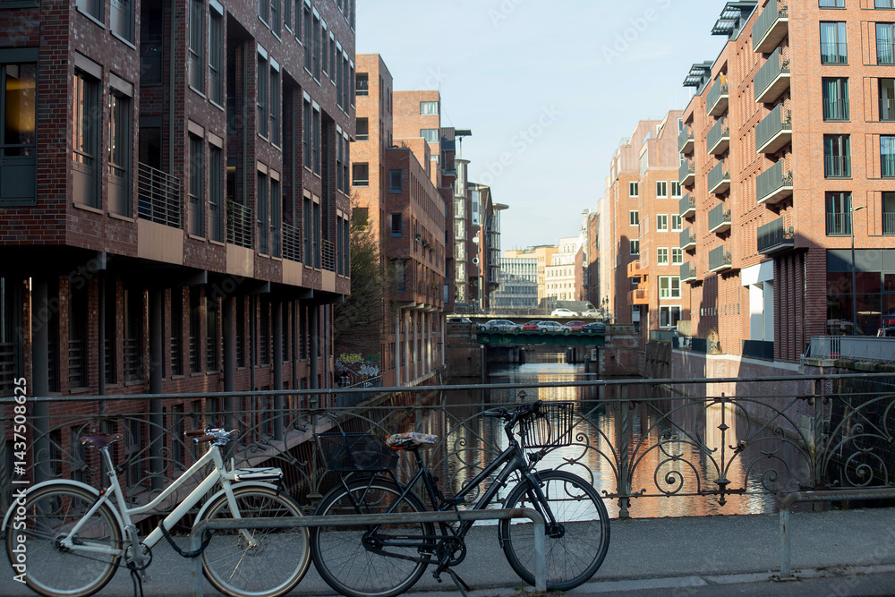 Fototapeta premium Bicycles on Bridge over Canal in Historic Hamburg Warehouse District