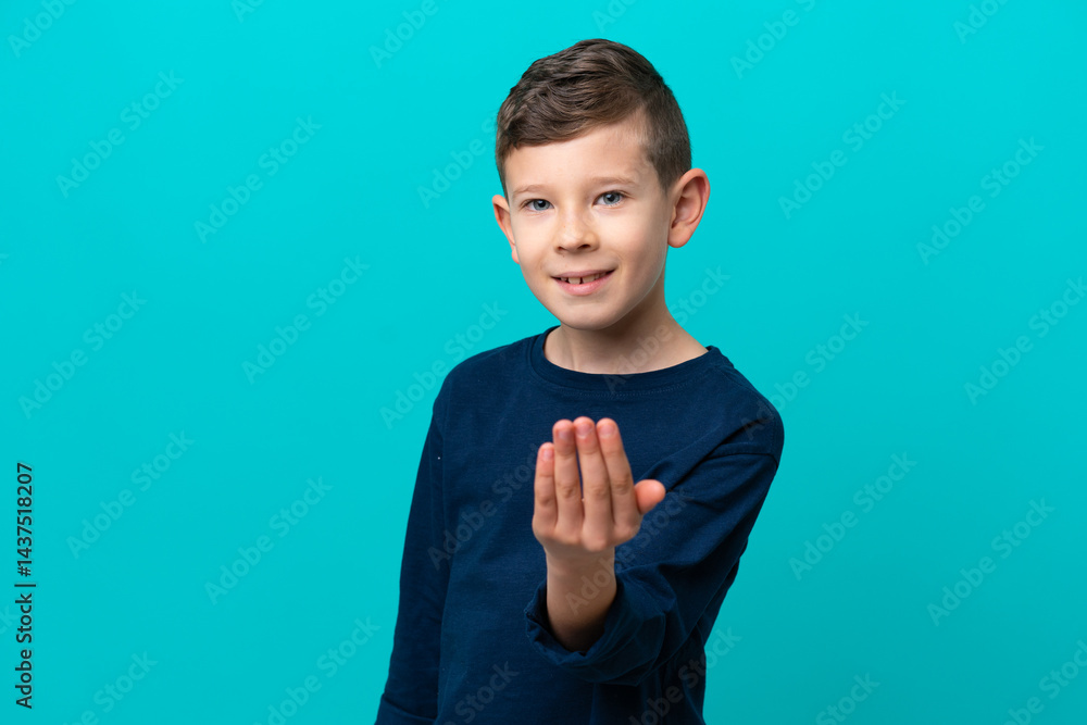 Little kid boy isolated on blue background inviting to come with hand. Happy that you came Little kid boy isolated on blue background inviting to come with hand. Happy that you came