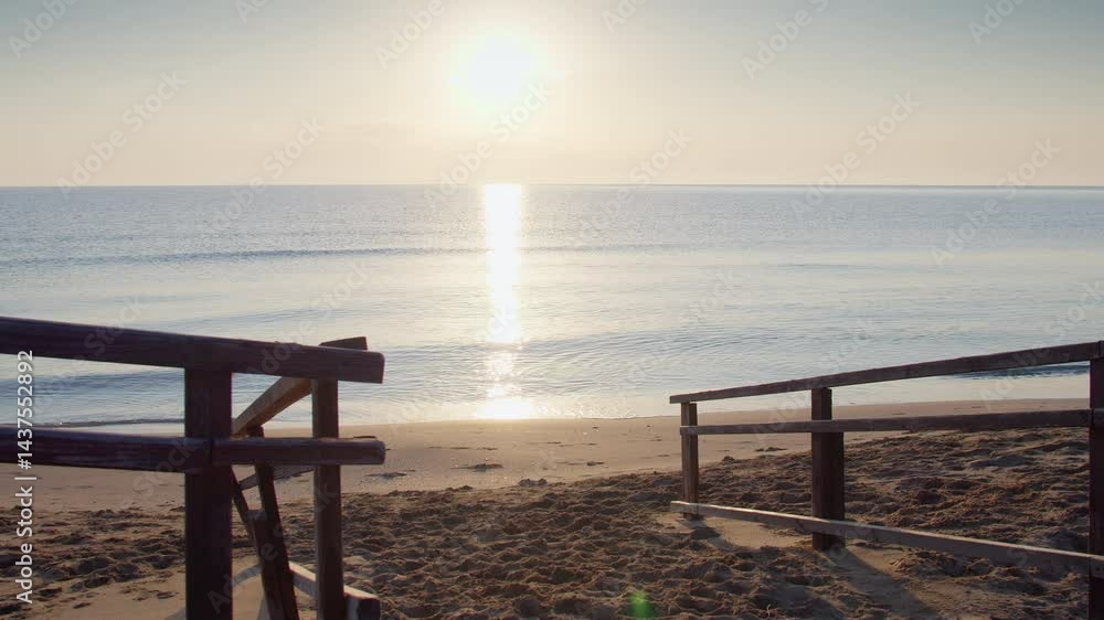 custom made wallpaper toronto digitalSun dawning over the sea, calm water with reflection of sunlight, deserted beach, camera movement