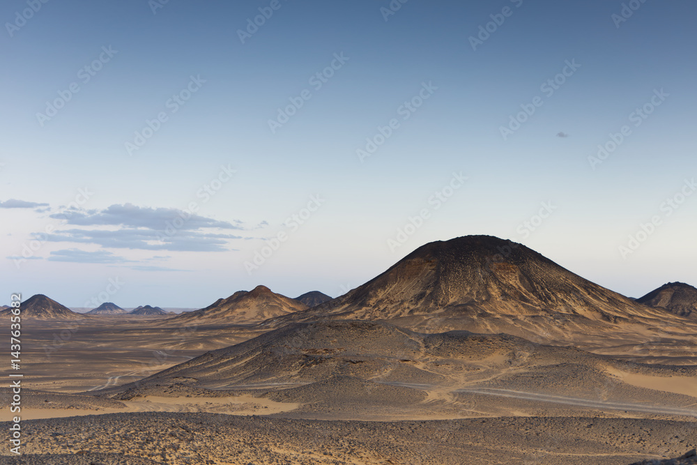 Sunset lights on the black desert in Egypt