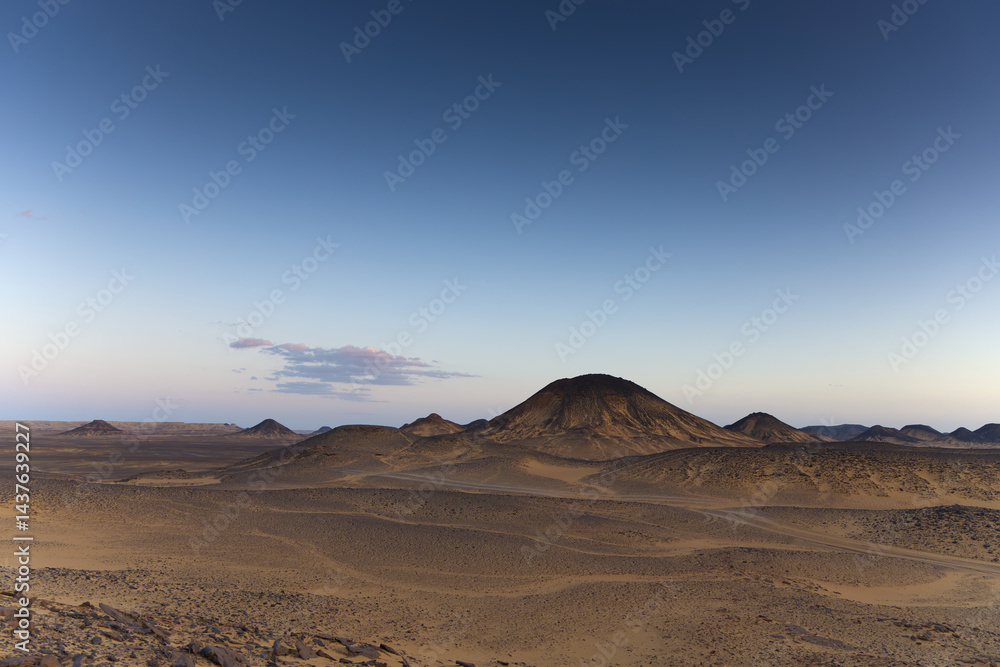 Sunset lights on the black desert in Egypt