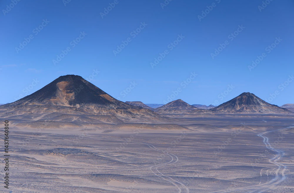 Sunset lights on the black desert in Egypt