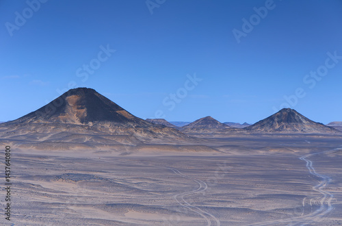 Sunset lights on the black desert in Egypt