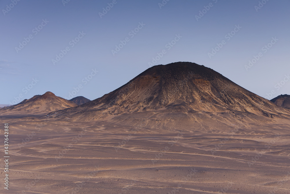 Sunset lights on the black desert in Egypt