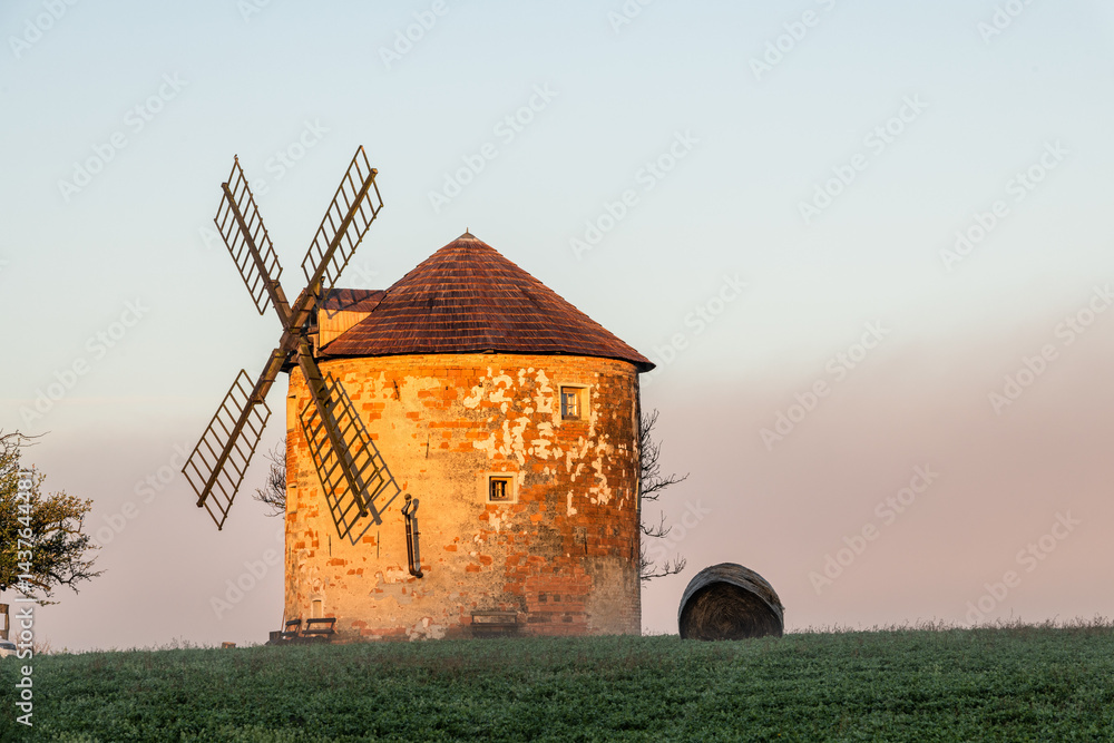 Traditional windmill in Kunkovice, Moravia, Czechia at sunrise