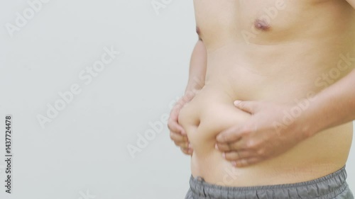 Fat man with big bellies and high fat the result of drinking beer every day.