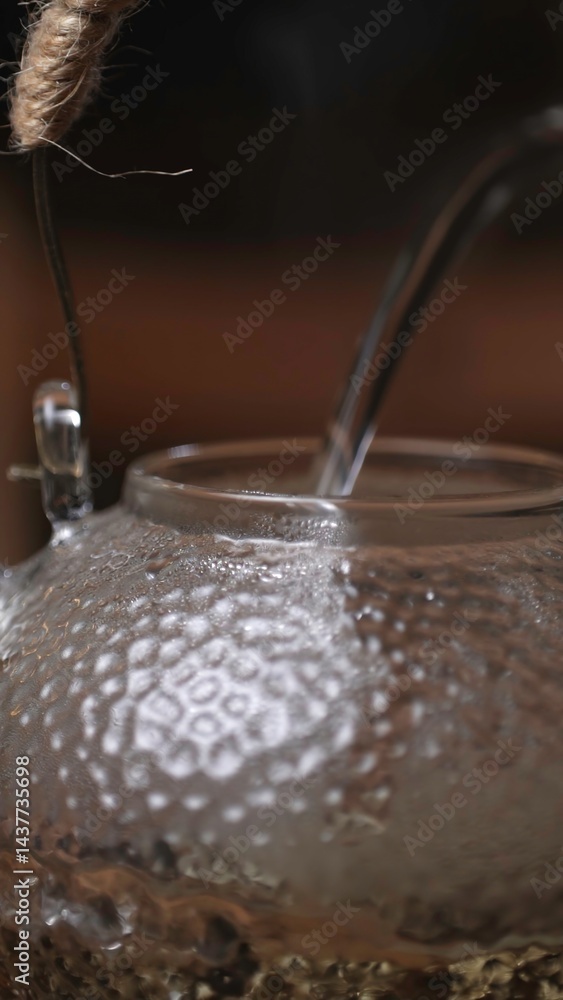 Fototapeta premium An Elegant Teapot with Water Pouring is a stunning representation of artistry in design. Media