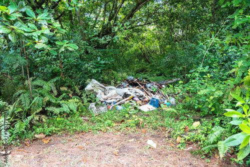 Obraz na płótnie Illegal waste dump in Seychelles jungle on Praslin Island, showing pollution, litter w salonie