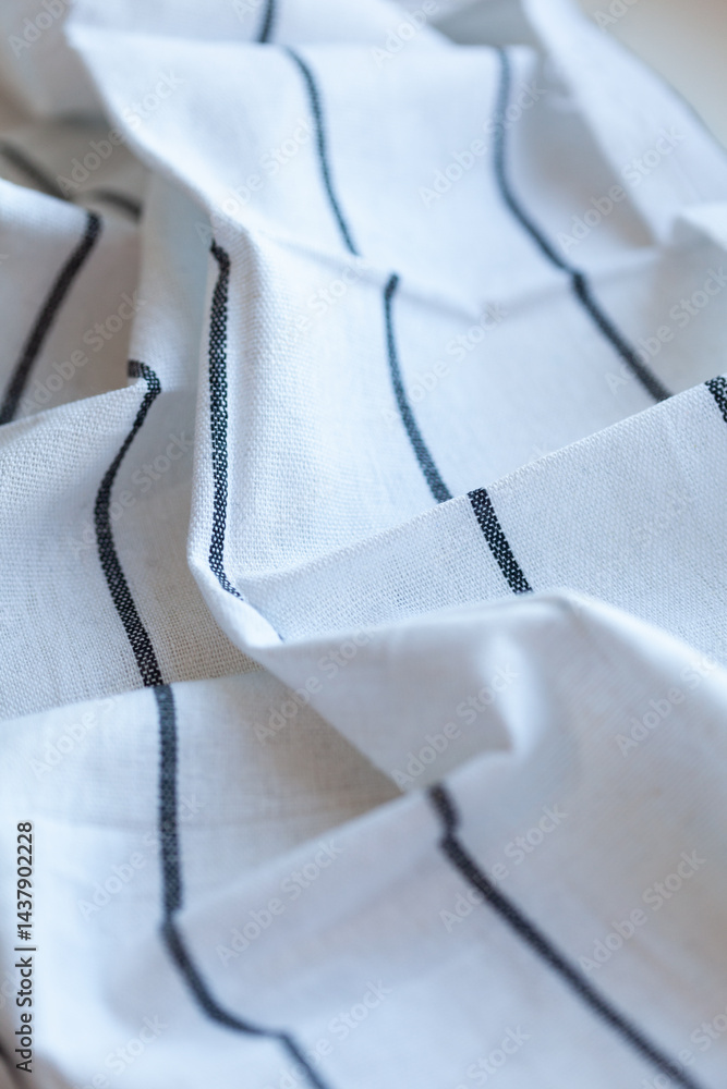 White Fabric with Black Stripes: This image captures the simplicity of white fabric adorned with sleek black stripes. Classic design in everyday materials. White Fabric with Black Stripes: This image captures the simplicity of white fabric adorned with sleek black stripes. Classic design in everyday materials.