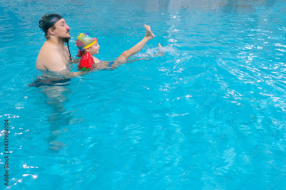 Happy middle-aged father swimming with cute adorable baby in swimming pool. Smiling dad and little child, boy having fun together. Active family spending leisure and time in spa hotel. Concept of kids
